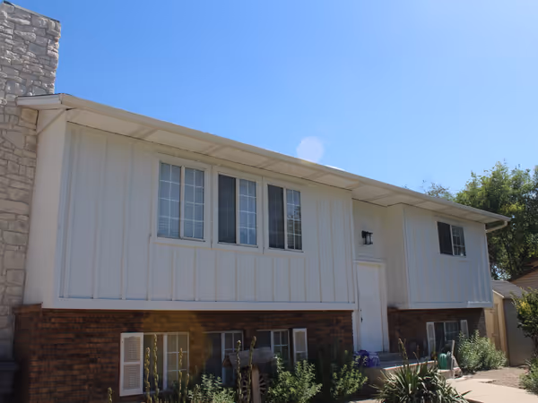Board And Batten Siding And Stone Chimney
