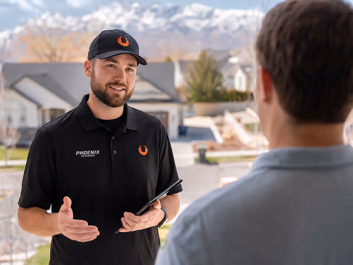 Phoenix Exteriors crew working on a residential rooftop