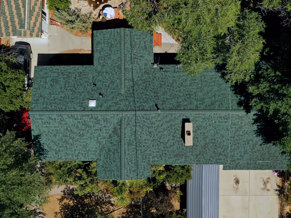 Aerial view of the same Orem, Utah home after roof replacement with Owens Corning Duration Chateau Green architectural shingles